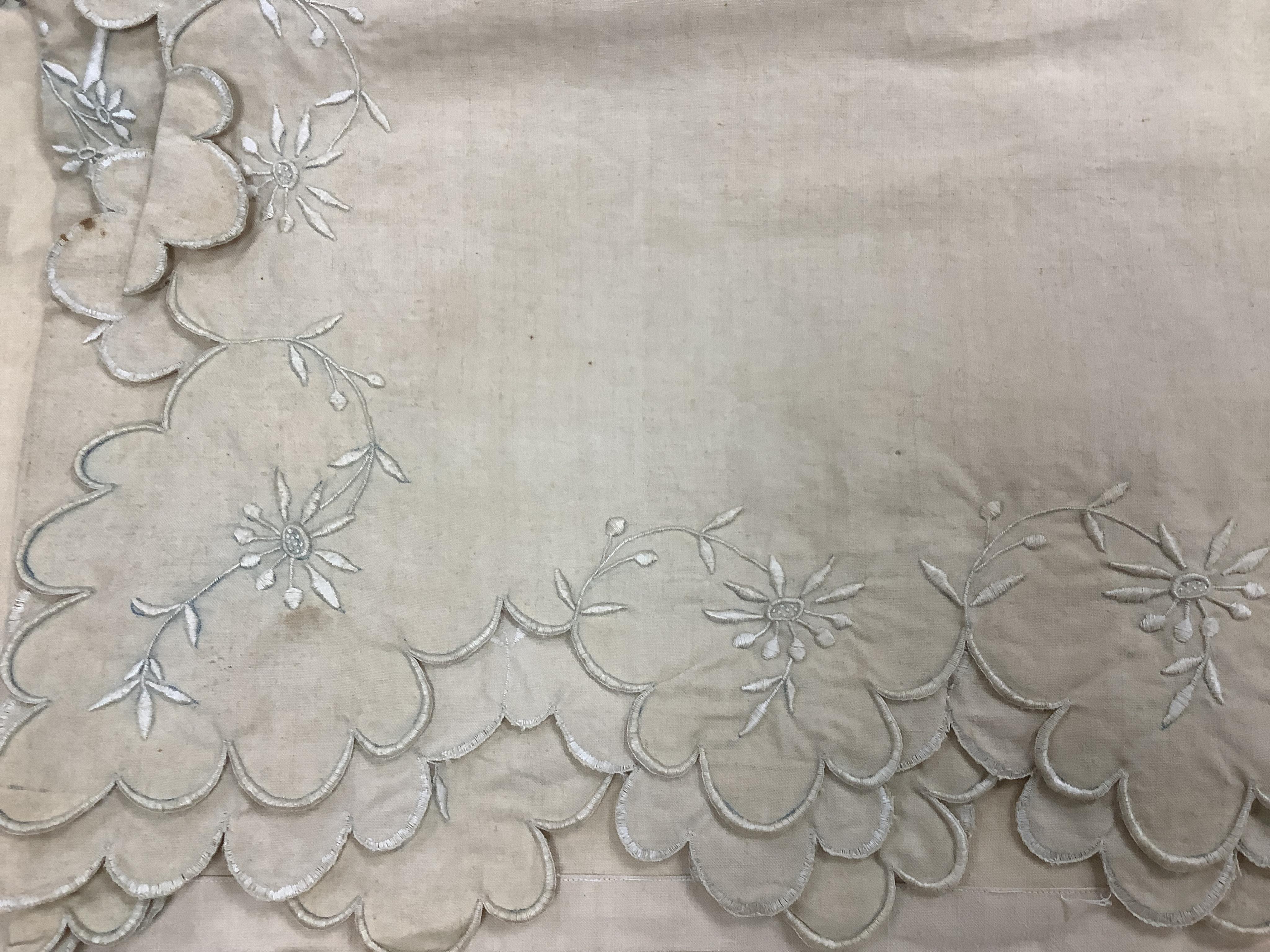 Three French provincial ecru coloured top sheets, with scalloped edged turn backs. One with a deep embroidered turn back, the other two narrower turn backs with cut work and embroidery, one unfinished cut work edge, line